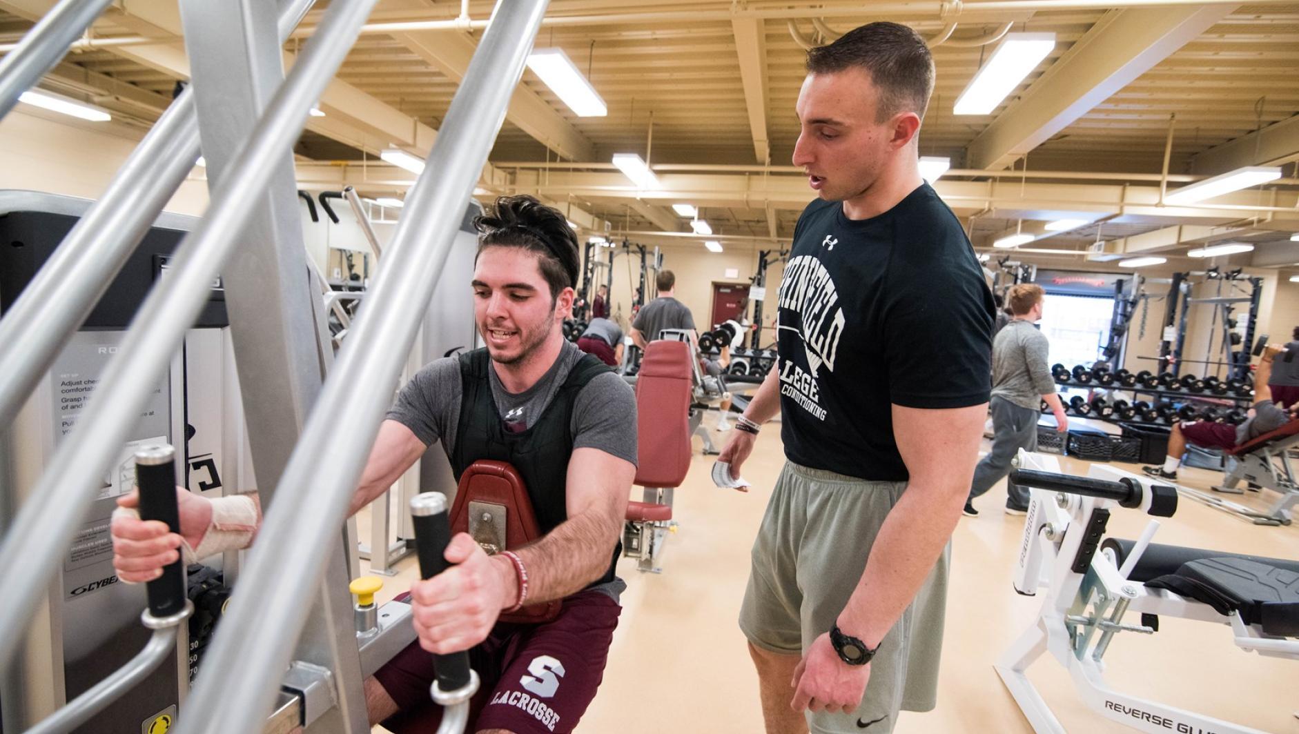 Student working out arms