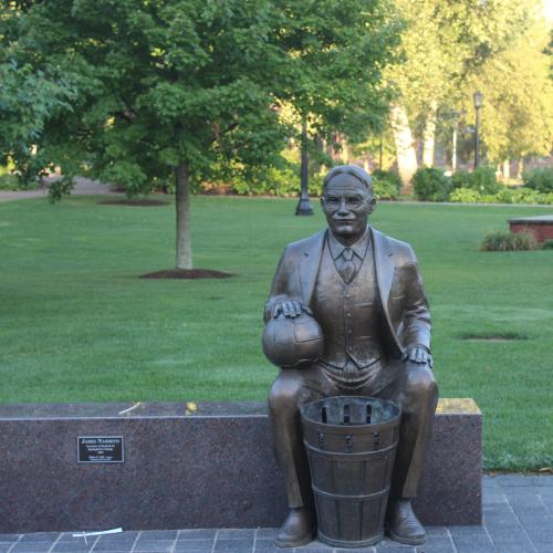 A statue of James Naismith sits on the Springfield College campus