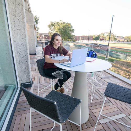 A student studies on Cooper Terrace.