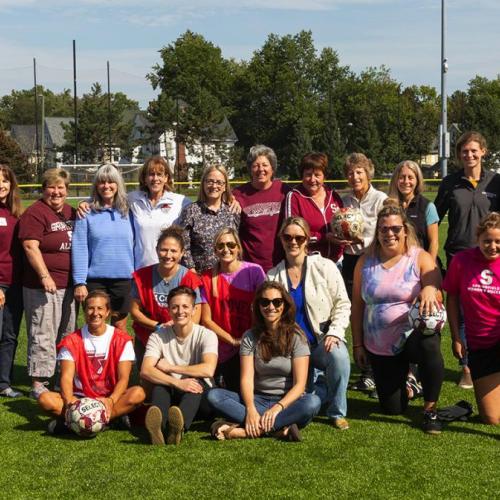Alumnae and friends—including first head coach Herb Zettel, current coach John Gibson, and members from the first women's soccer team—gathered to celebrate the 40th anniversary of women's soccer at Springfield College.