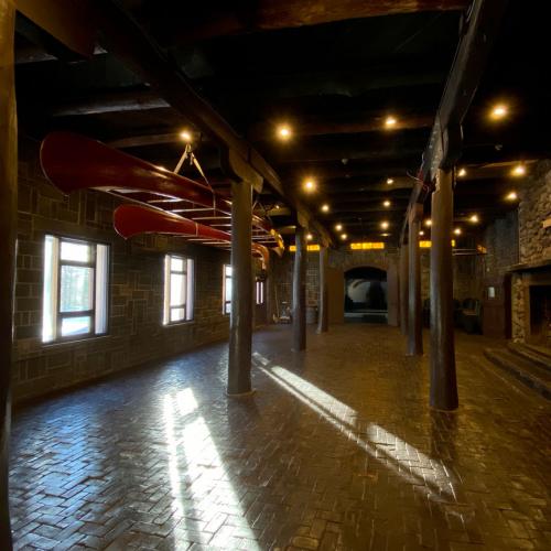 Inside a building at east campus, where canoes are hanging upside down from the ceiling