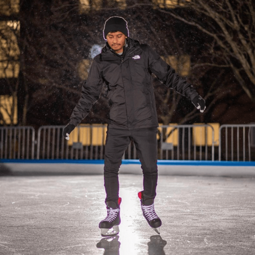 A student skates on the outdoor ice rink