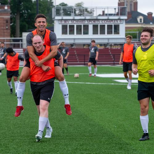 Members of the Men’s Soccer team ham it up for the camera during a workout