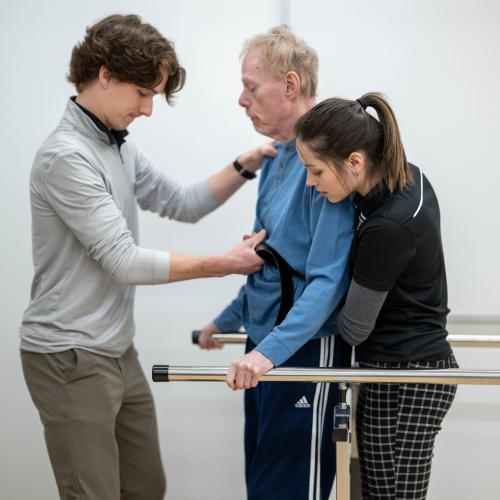 Physical therapy students work with community members during a Community Clinic in the