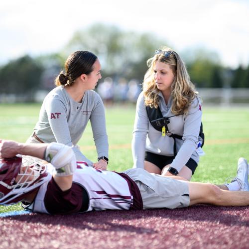 Springfield College Department of Exercise Science and Athletic Training assistant professor of Athletic Training Kelsey Rynkiewicz works with 