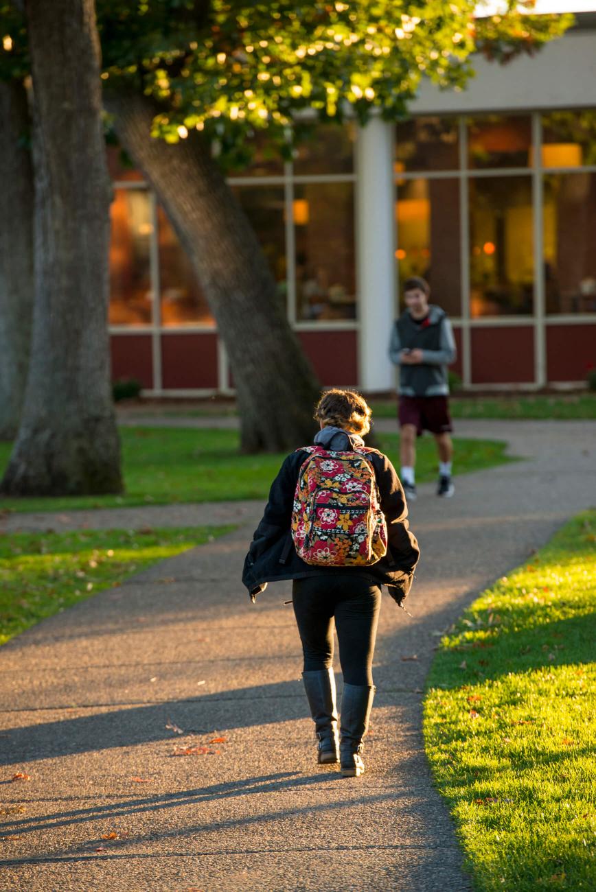 A student walking to Cheney.