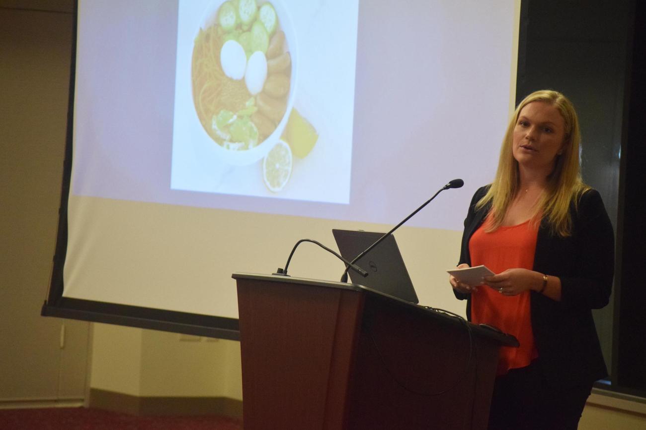 At left, Springfield College graduate and Founder and CEO of Lean and Green Body Jennifer Khosla, speaks to students at the Fit After 40 event.