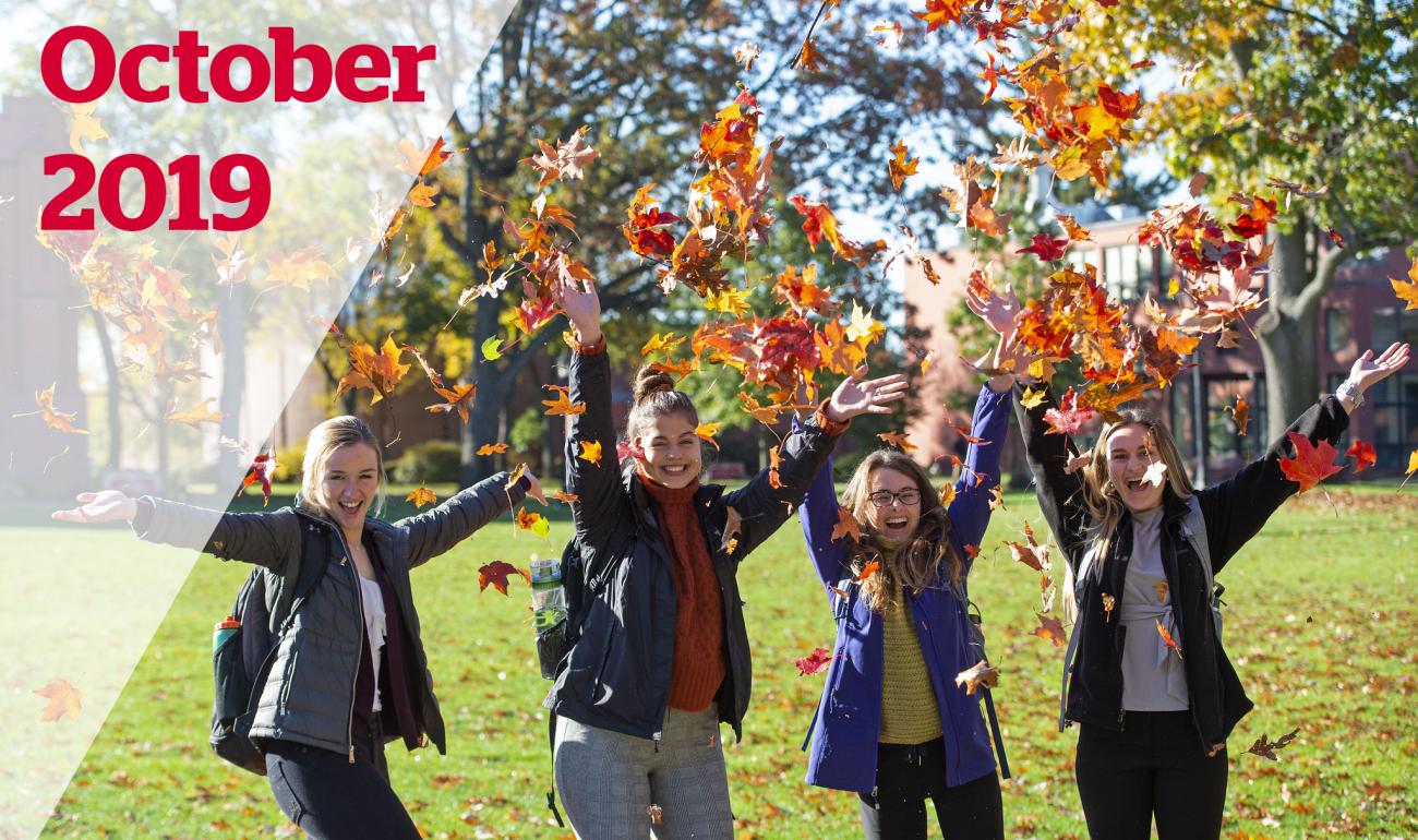 Students throw leaves