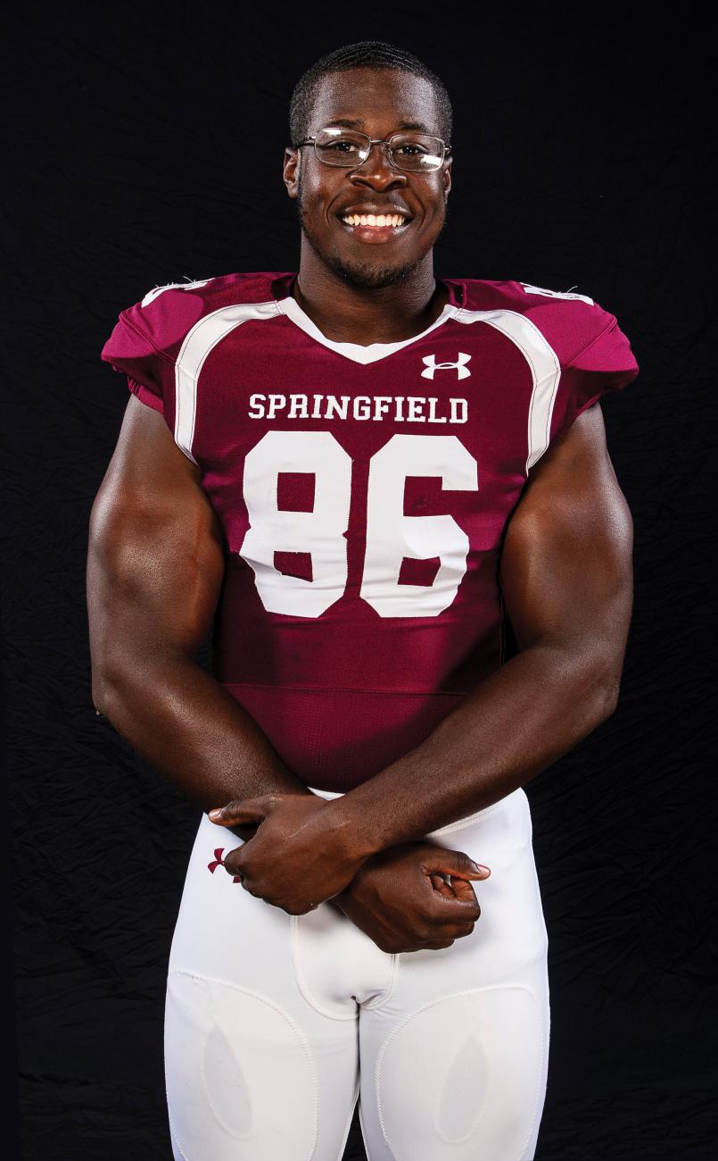 Shamar Martin of Springfield College stands in his football uniform
