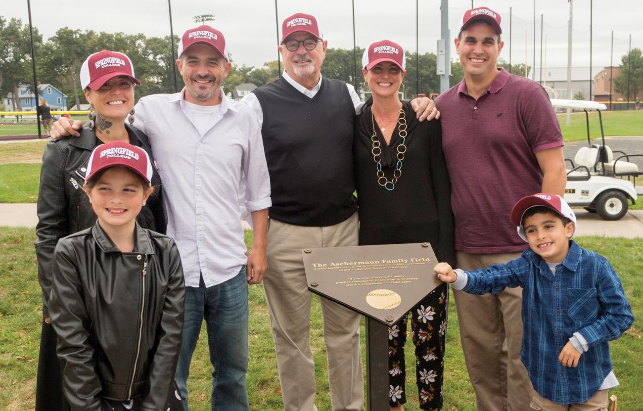 Kurt Ascherman ’71, center, with his family at the October dedication of the Aschermann Family Field