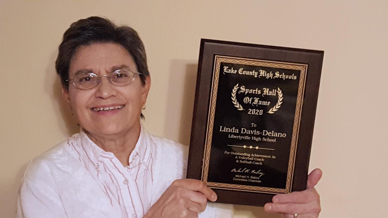 Linda Davis Delano with plaque