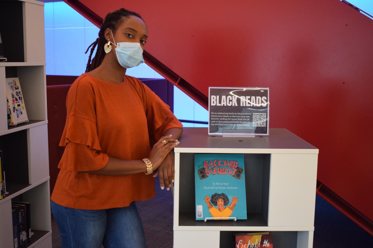 The display included Springfield College Community Director for International Hall Sheona Douglas' children's book on display, "Backyard Bashment."