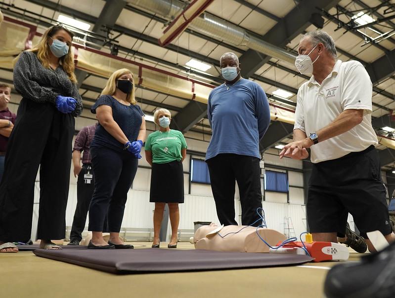The CPR training is part of an awareness campaign to support Tim's son Timmy Allen, a local middle school principal and coach, who suffered a major heart attack in early July and is now recovering.