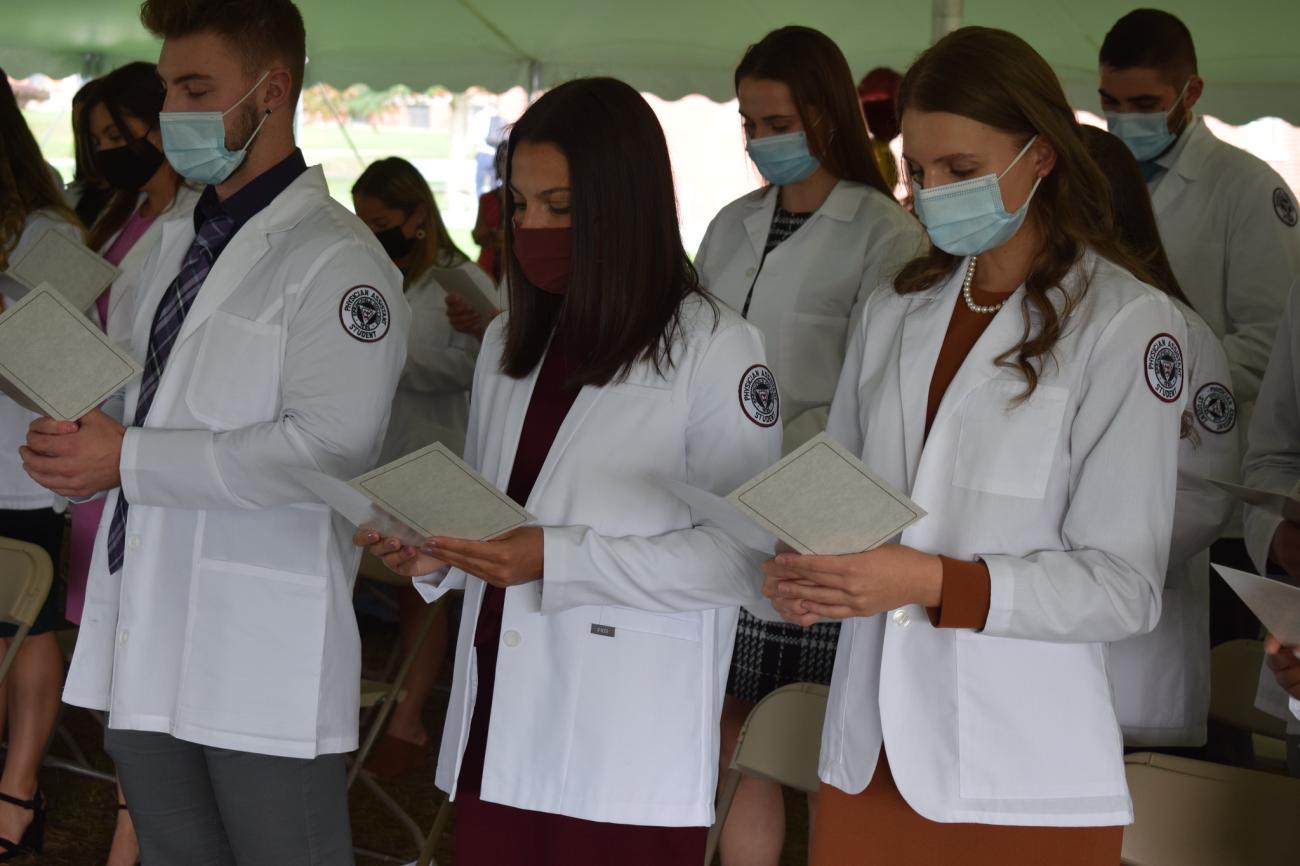 The Springfield College Physician Assistant Program hosted the annual White Coat Ceremony on the campus on Reed Green on Friday, Oct. 8, 2021.  The White Coat Ceremony commemorates the formal presentation of the white lab coat for physician assistant students as they begin working with patients in hospitals.