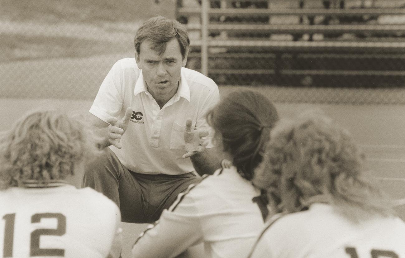 archival photo of Herb Zettl coaching women's soccer student-athletes