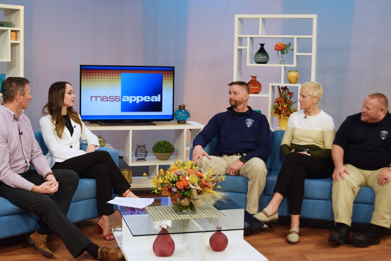 five people talking on the set of MassAppeal