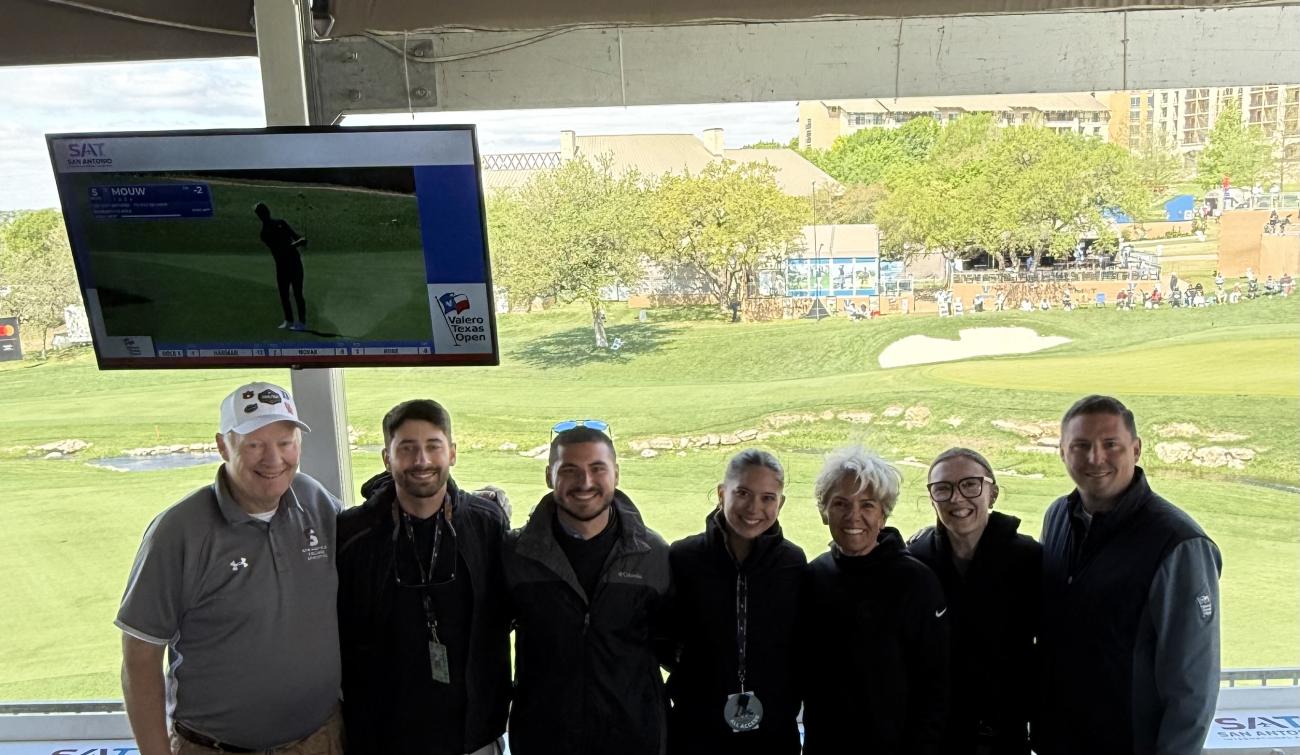 Springfield College President Mary-Beth Cooper and Dave Cooper recently visited with alumni at the TPC San Antonio for the Valero Texas Open.