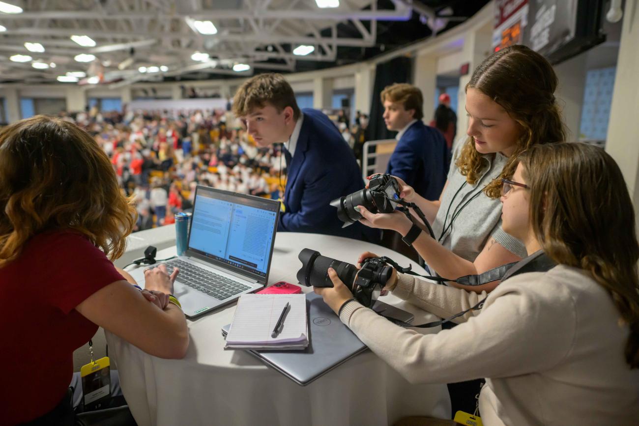 Members of the Springfield College Communications and Sports Journalism program, Kaleb Knowles, Nina Hutchins and Emma Bynes work to cover stories and photograph the action during the NCAA Division III Men’s Volleyball championship at Blake Arena in Springfield, Mass., on Thursday, April 23, 2026.