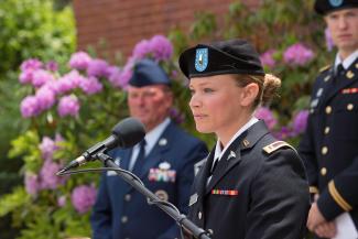 A veteran speaks at a podium during a ceremony