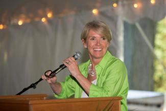Dr. Cooper speaks at a podium
