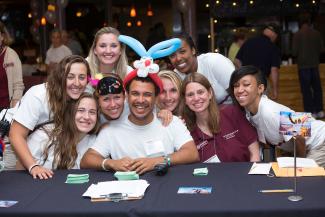 Student workers smile at the camera at reunion