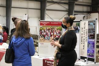 A staff member discusses programs at Springfield College