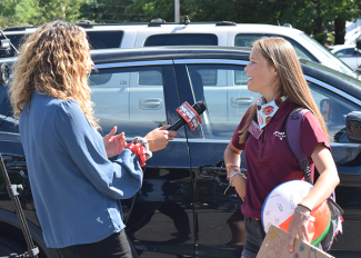 Julia Kidman (at right) talks to Western Mass News