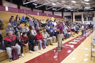 Football Coach Mike Cerasuolo talks to prospective families