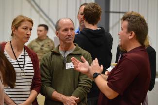 New parents and students talking to Springfield College employee