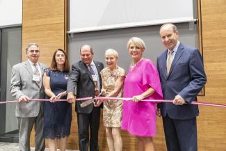 Springfield Mayor Domenic Sarno, Physician Assistant Studies Chair Meghan Migeon, Chair of the Board of Trustees William A. Burke III, School of Health Sciences Dean Brooke Hallowell, President Mary-Beth Cooper, and Baystate Medical Center Chief Executive Officer Mark A. Keroack.