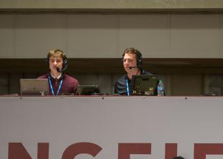 Dante Lafrate, left, a Springfield College student trustee and Communications and Sports Journalism major, works during the broadcast during the NCAA Division III Men’s Volleyball championship at Blake Arena in Springfield, Mass., on Thursday, April 23, 2026.