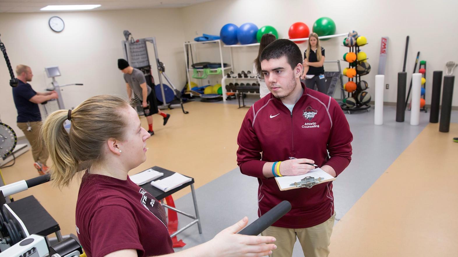 Athletic counseling students practicing classroom skills in a facility on the campus