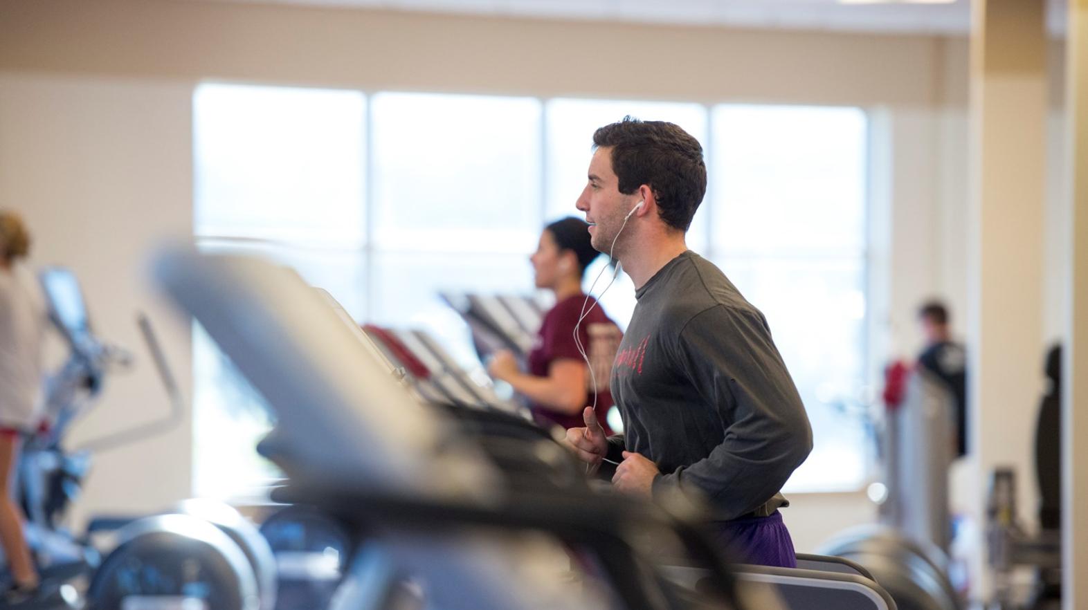 Male student works out in the Wellness Center within the Springfield College Wellness & Recreation Complex 