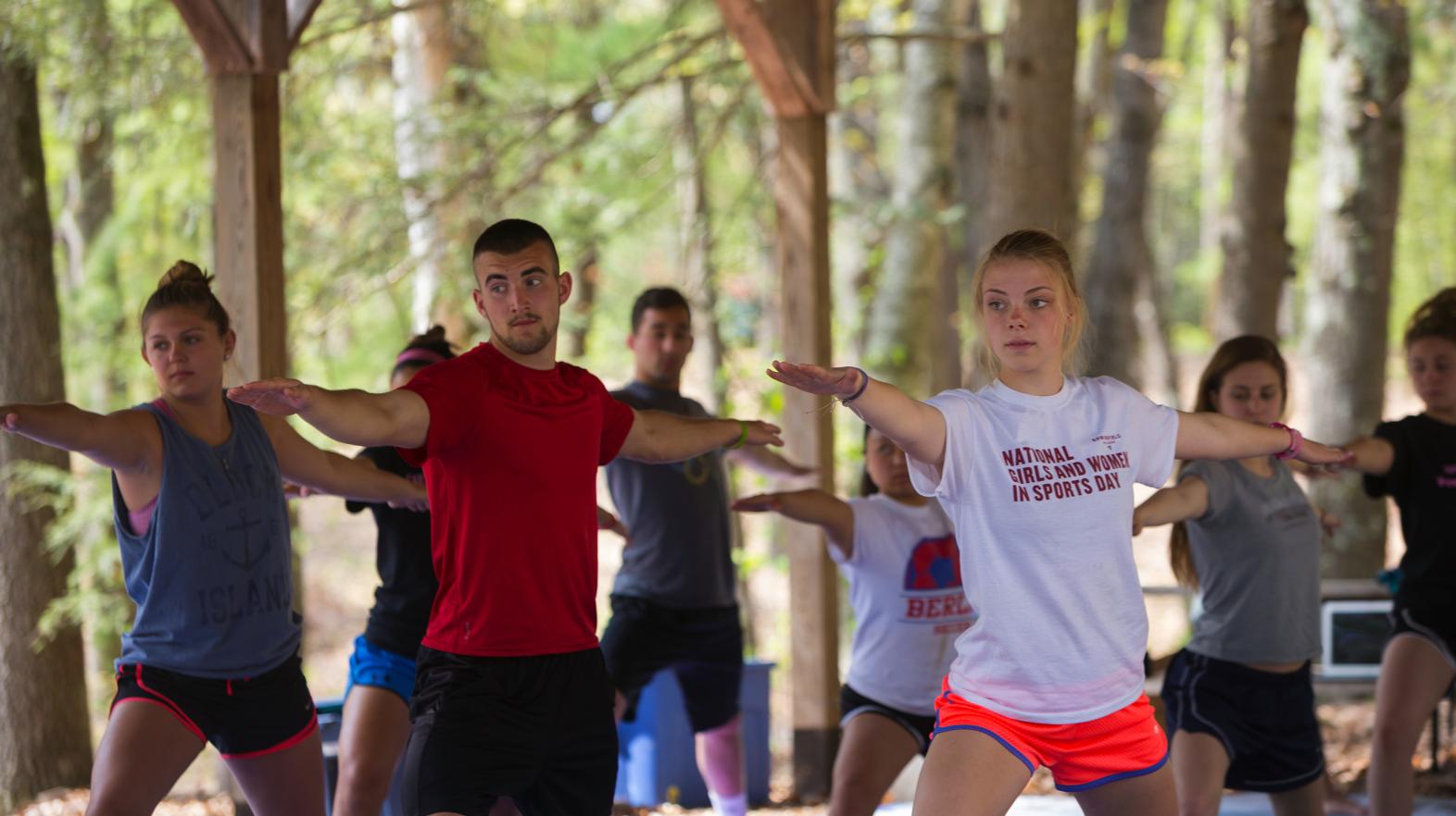 Students practice yoga during Outdoor Pursuits at Springfield College