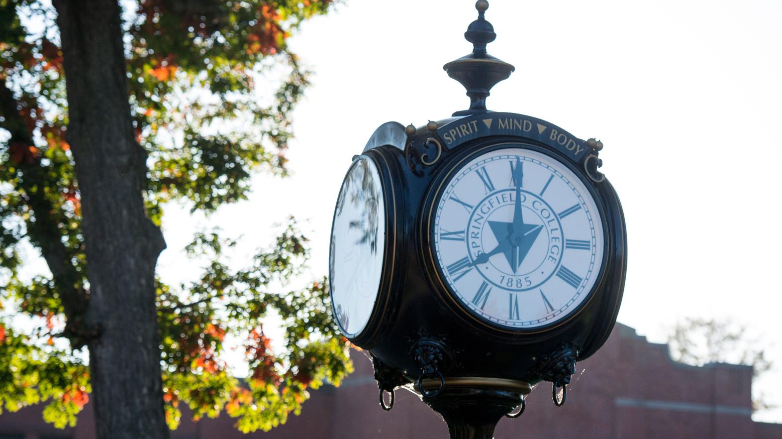 The Springfield College campus clock, reading spirit, mind, and body on it.