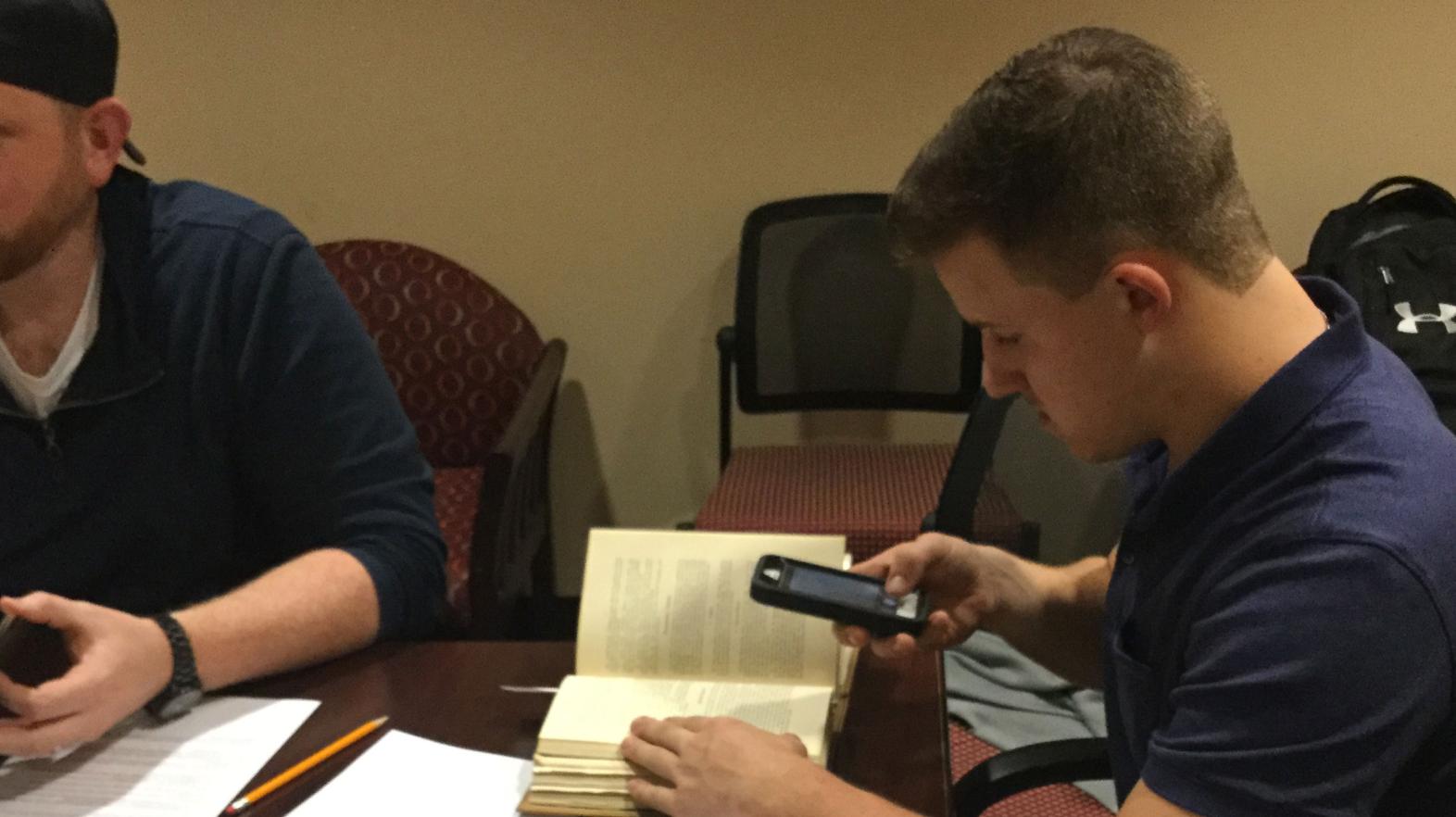 An American studies major does research in the archives for a project on Springfield College.