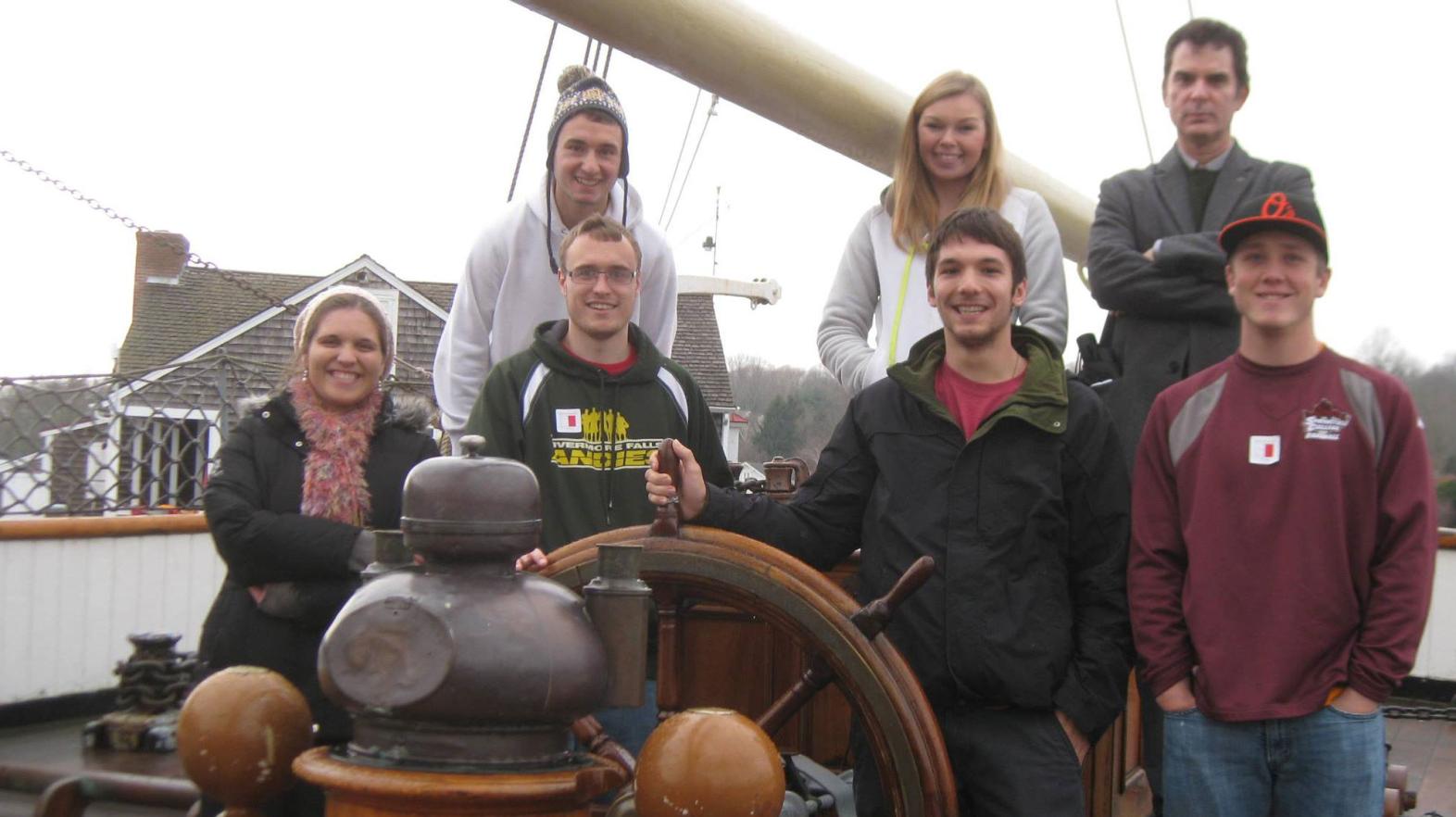 Students pose during a field trip to Mystic Seaport where at Springfield College alumna is employed.