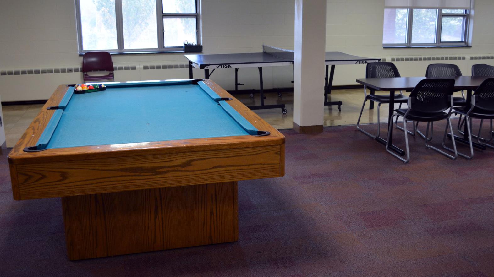 A pool table is included in the basement lounge of Massasoit hall.
