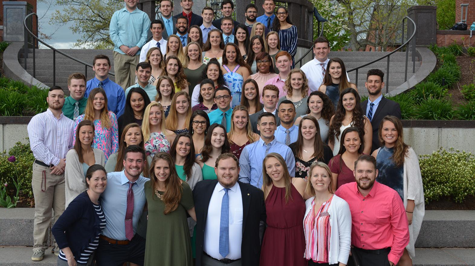 New Student Orientation Leaders pose on the steps outside of the campus union