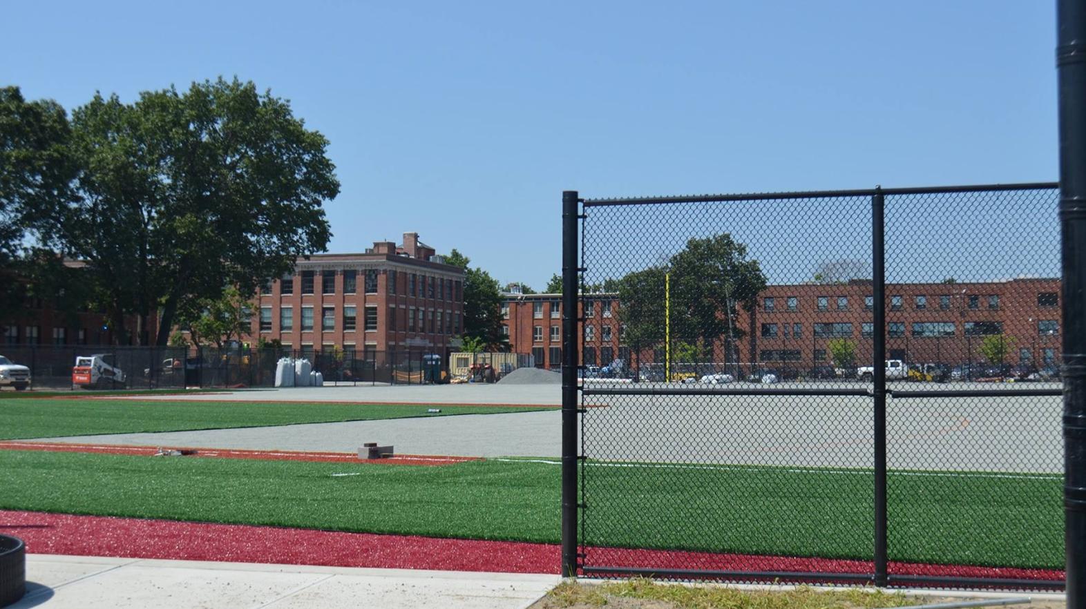 The first section of turf is laid.