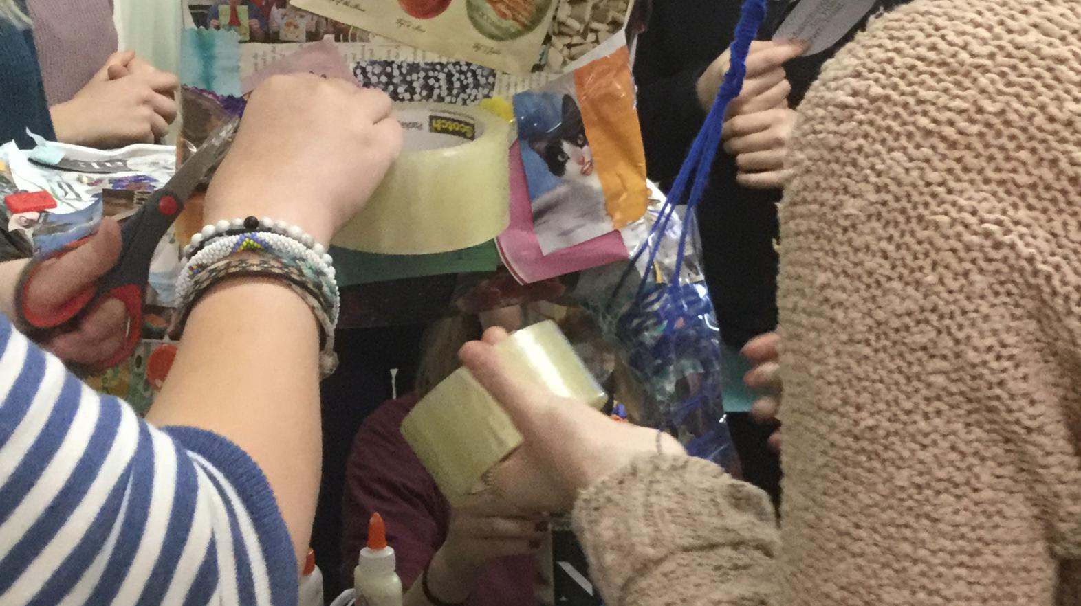 A close up of students working on the chair.