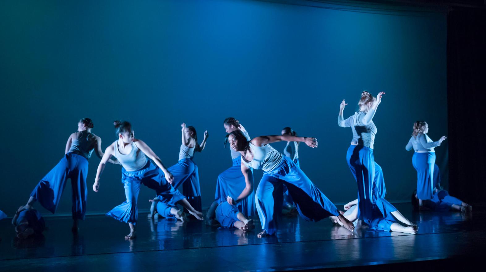 Springfield College dancers performing on stage. 