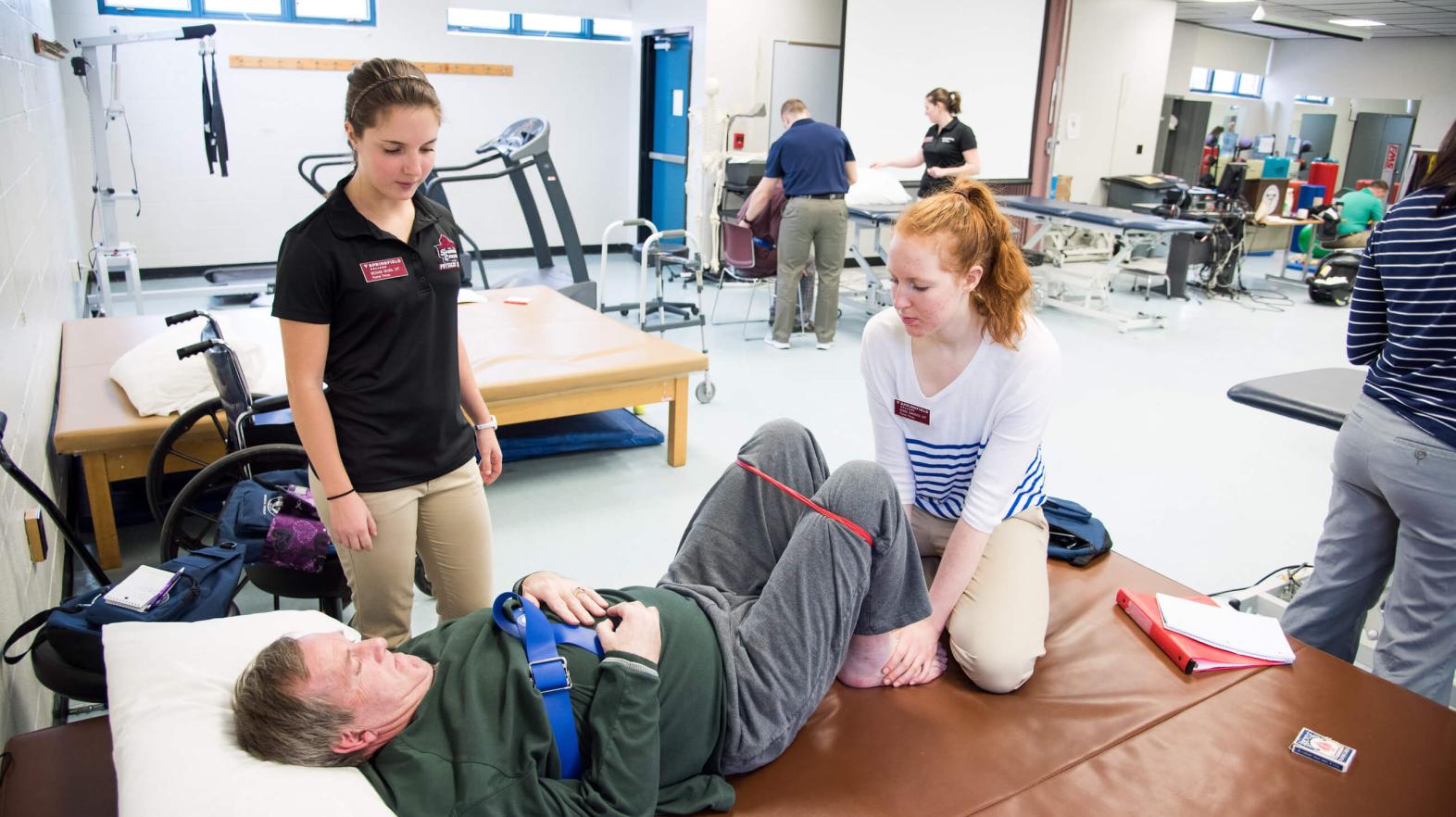 Students work with patients in the stroke clinic on campus. 