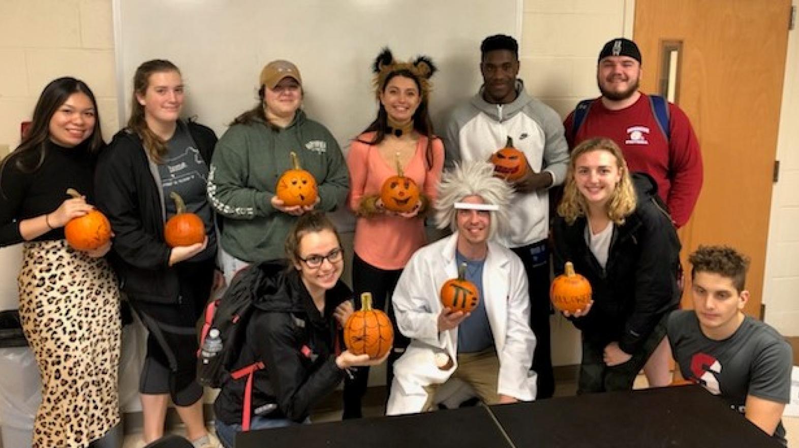 Students in the Department of Mathematics, Physics, and Computer Science participate in a Pumpkin contest at Halloween
