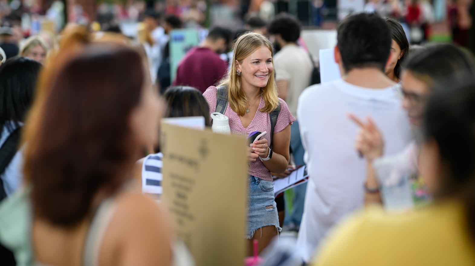 Student attending the annual club fair on Naismith green