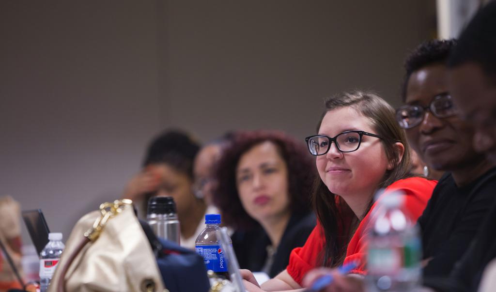 Students sitting in class listening to lecture