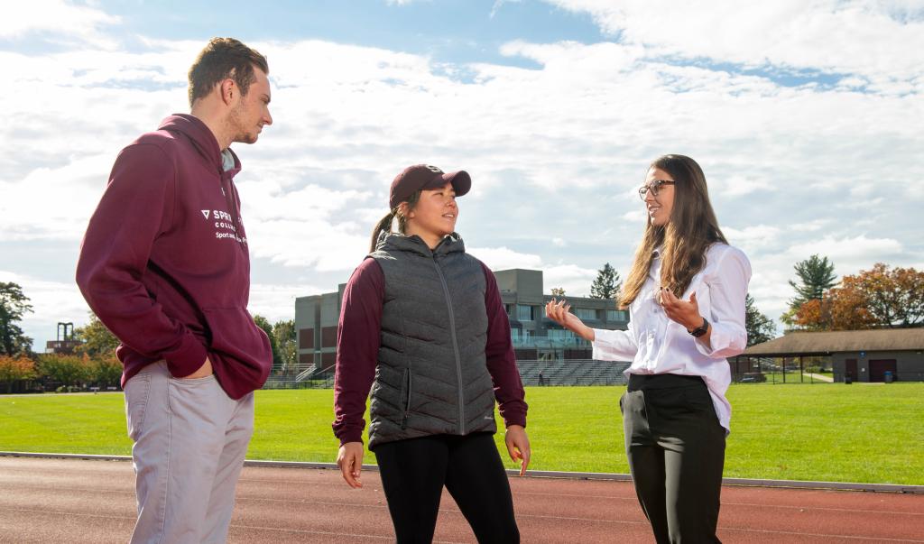 Springfield College Assistant Professor of Exercise Science Kathleen Mellano works with students on the Blake Track