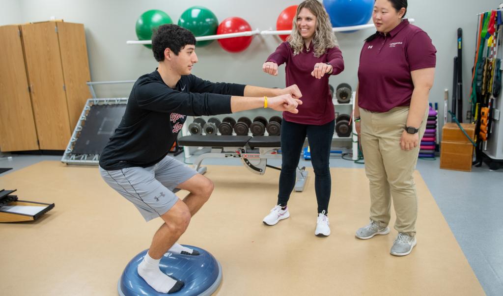 Athletic training faculty and students in the athletic training facilities at Springfield College
