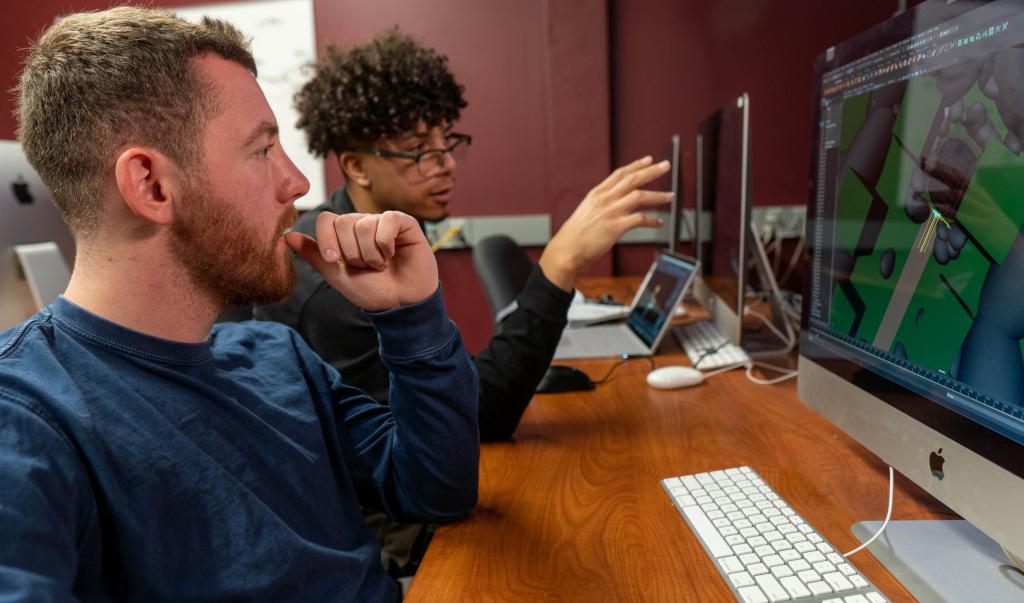 Undergraduate students collaborate during a computer graphic design course in Blake Hall at Springfield College on December 16, 2021.