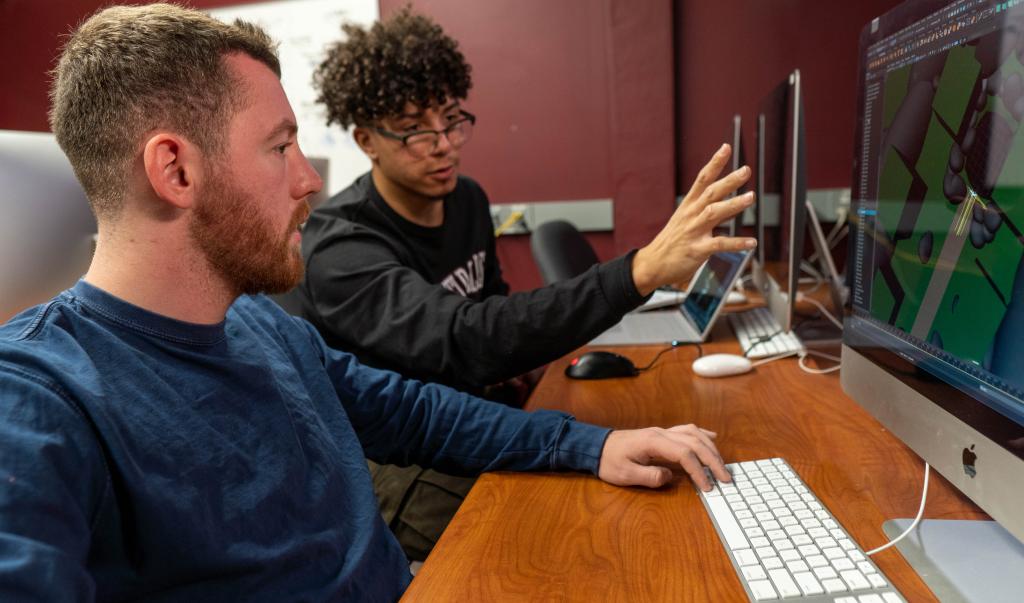Undergraduate students collaborate during a computer graphic design course in Blake Hall at Springfield College on December 16, 2021.